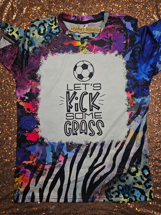 Soccer Let's Kick Some Grass Wild Zebra Bleached Tee